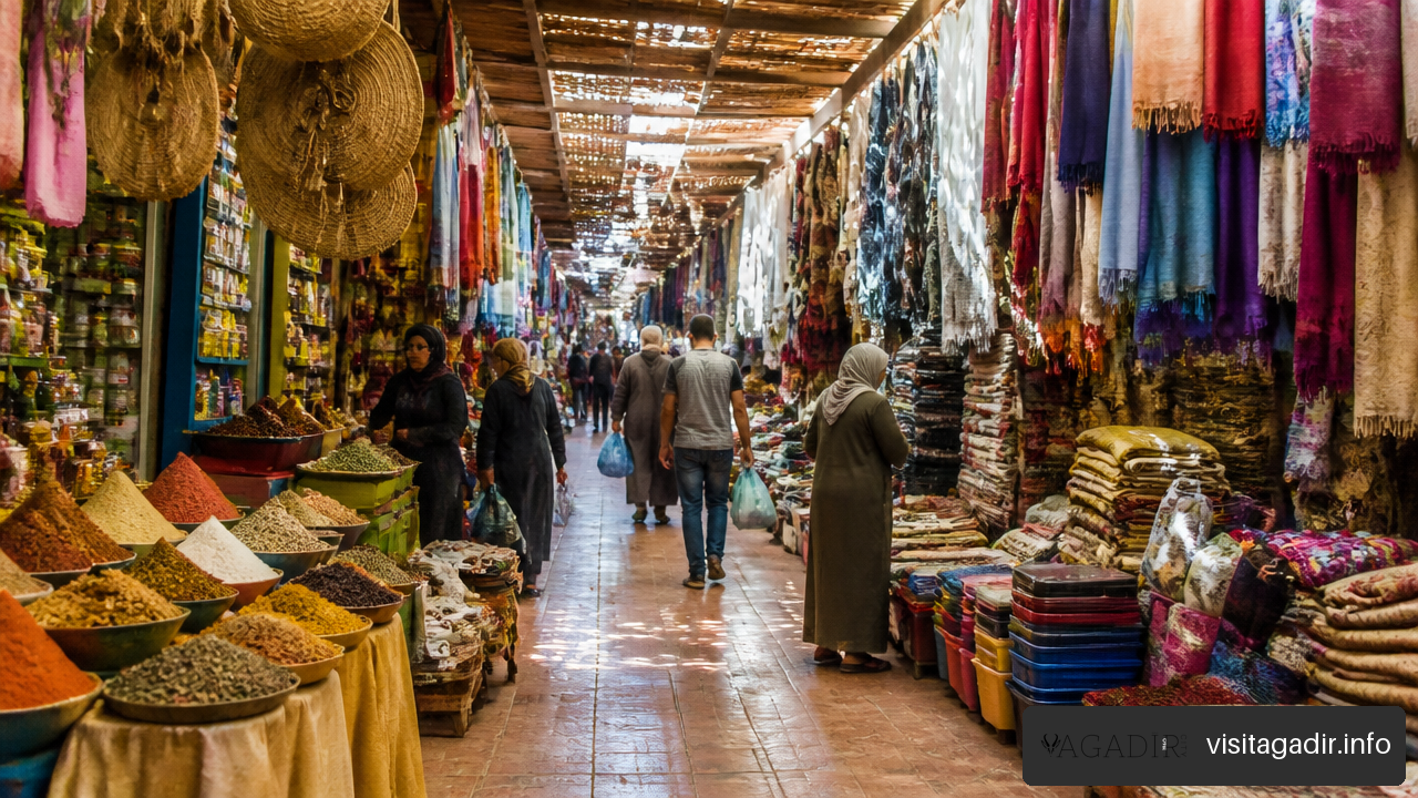 Visitors browsing inside the covered aisles of Souk El Had Agadir